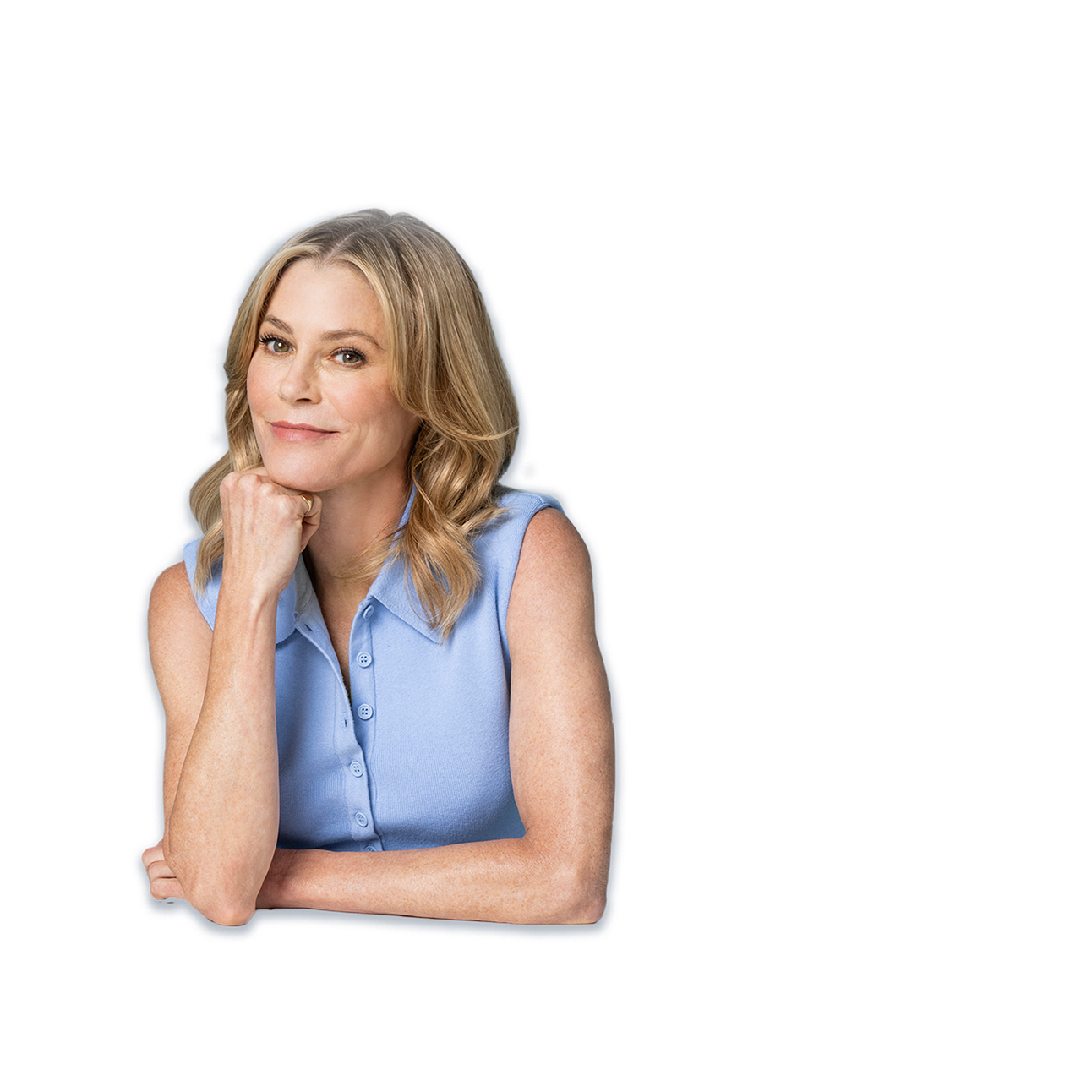 Julie Bowen smiling with he chin on her fist